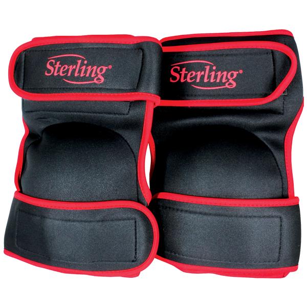 Pair of black wrist wraps with red trim and Velcro closures, Sterling brand, used for wrist support during weightlifting.