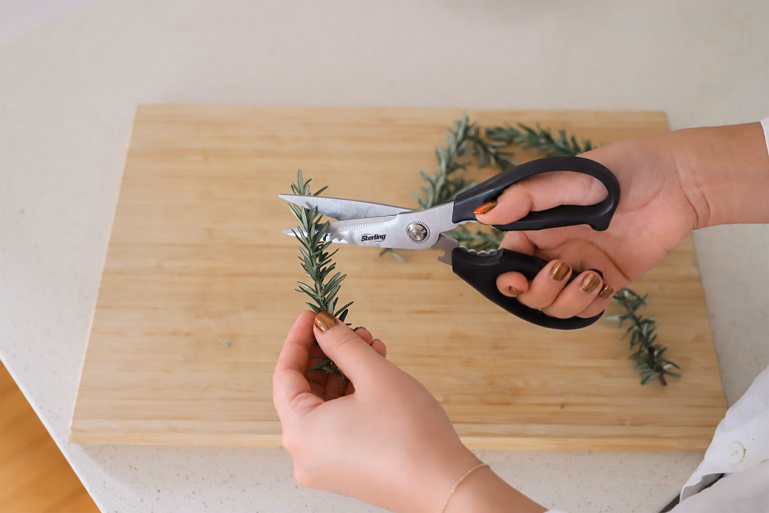 Kitchen shears cutting fresh herbs